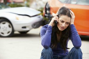 woman on the phone with car accident lawyer
