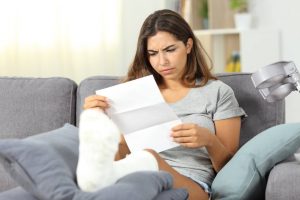 st. louis woman reading denial letter from insurance