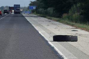 tire on the side of the highway