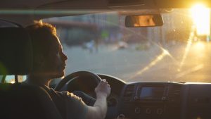 driver with sunglare on windshield